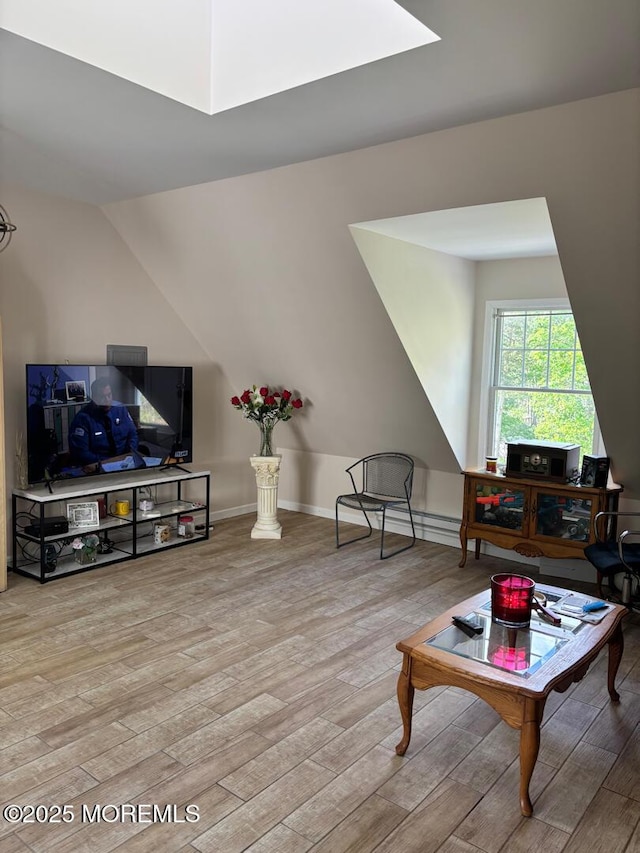 231 Friendship Rd, Howell, NJ 07731 - living area with wood finished floors, lofted ceiling, and a skylight