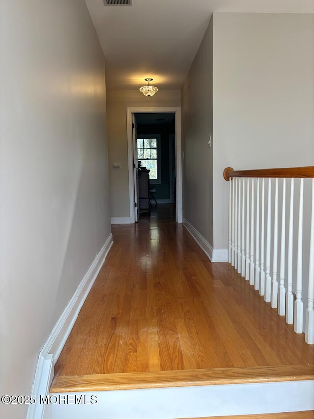 231 Friendship Rd, Howell, NJ 07731 - corridor with wood finished floors and baseboards