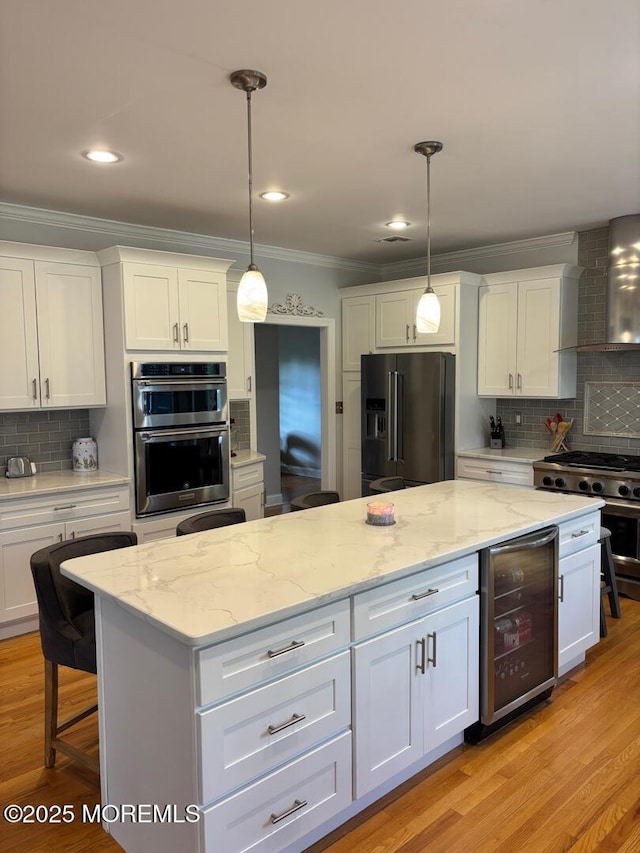 231 Friendship Rd, Howell, NJ 07731 - kitchen with high quality appliances, beverage cooler, wall chimney range hood, backsplash, and crown molding