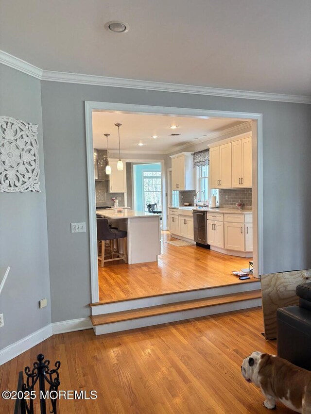 231 Friendship Rd, Howell, NJ 07731 - kitchen with dishwasher, crown molding, white cabinets, tasteful backsplash, and light countertops