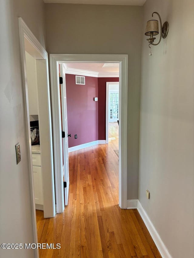 231 Friendship Rd, Howell, NJ 07731 - corridor featuring light wood-style flooring, baseboards, and crown molding