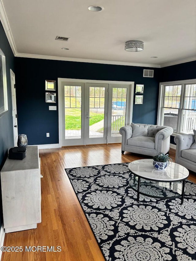 231 Friendship Rd, Howell, NJ 07731 - living room featuring wood finished floors, crown molding, and baseboards
