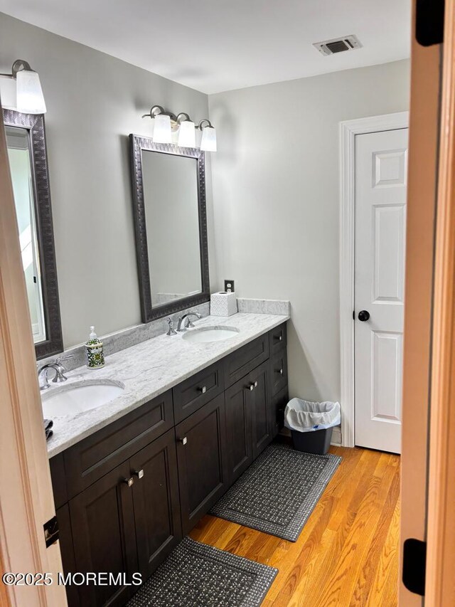 231 Friendship Rd, Howell, NJ 07731 - bathroom featuring wood finished floors and double vanity