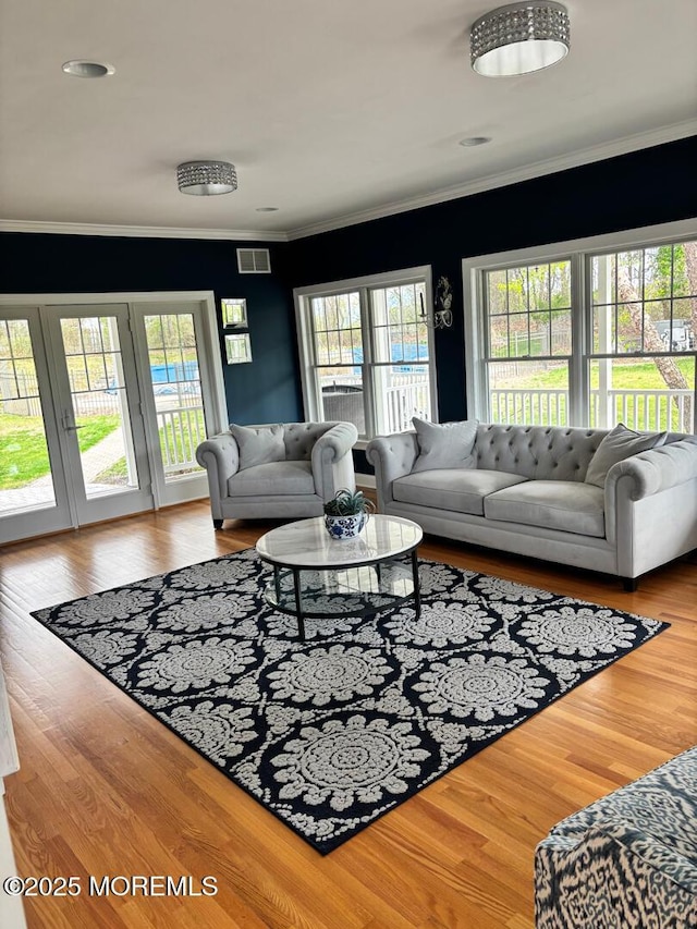 231 Friendship Rd, Howell, NJ 07731 - living room with plenty of natural light, crown molding, and wood finished floors