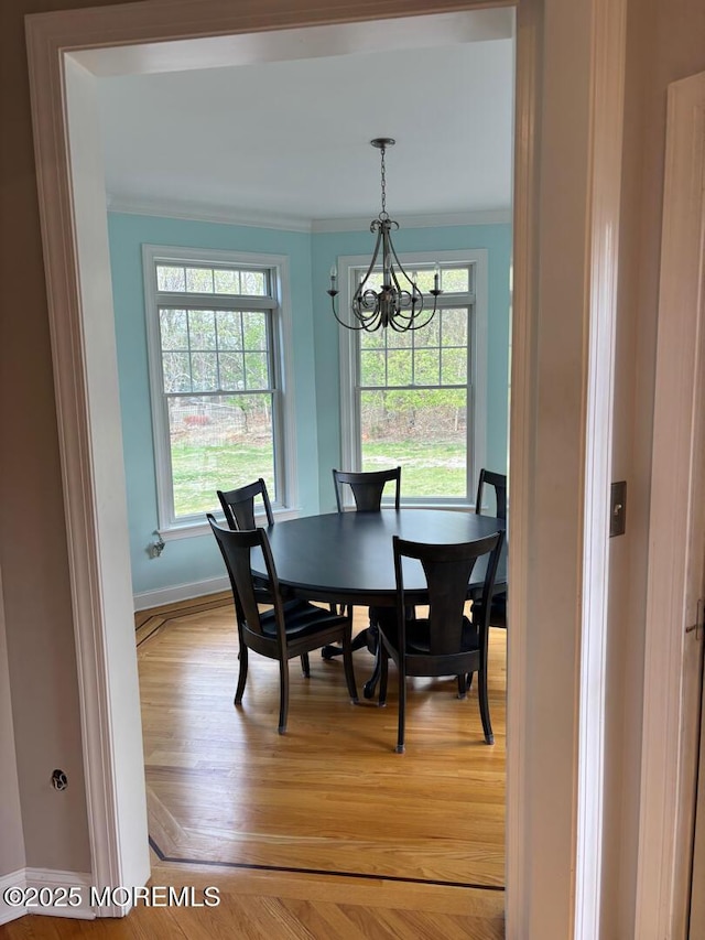 231 Friendship Rd, Howell, NJ 07731 - dining room with ornamental molding, a chandelier, baseboards, and light wood finished floors