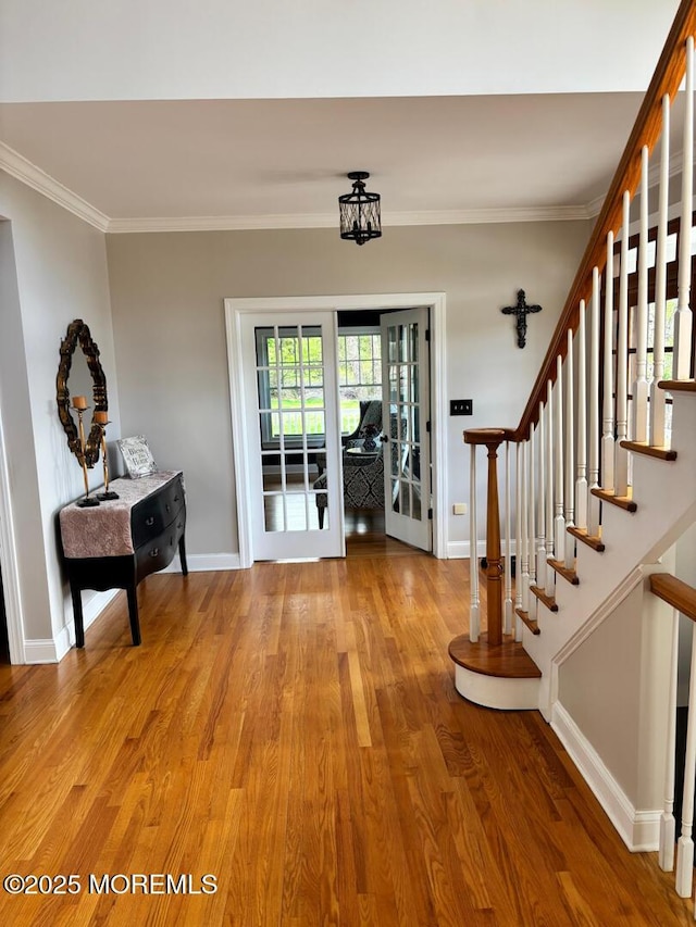 231 Friendship Rd, Howell, NJ 07731 - foyer with light wood finished floors, baseboards, stairs, and crown molding