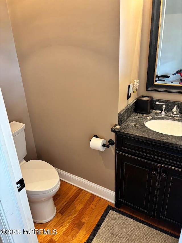 231 Friendship Rd, Howell, NJ 07731 - half bath with toilet, vanity, wood finished floors, and baseboards
