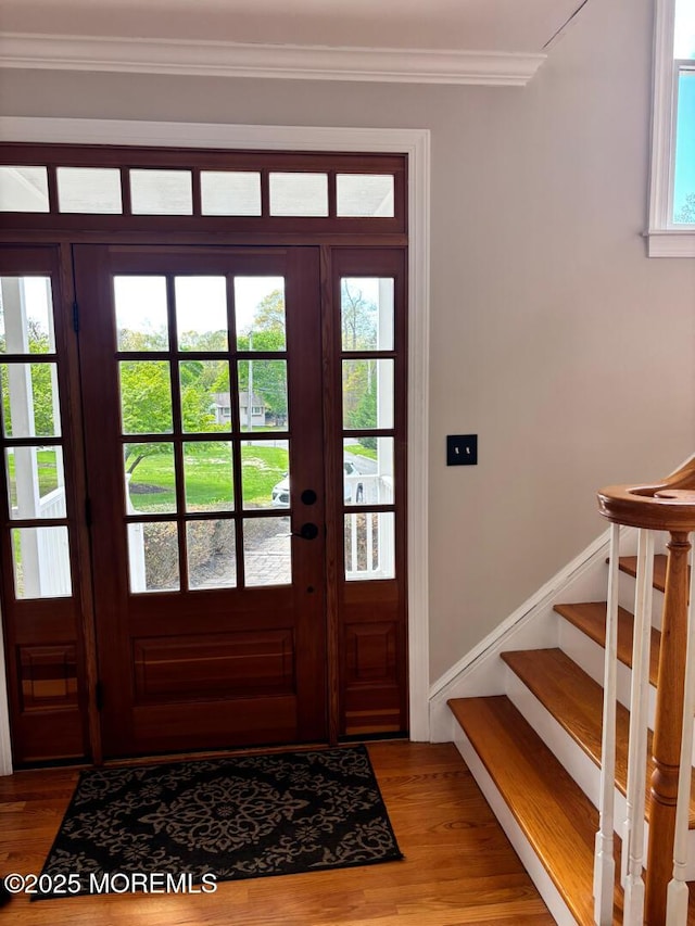 231 Friendship Rd, Howell, NJ 07731 - foyer featuring wood finished floors, ornamental molding, and stairway