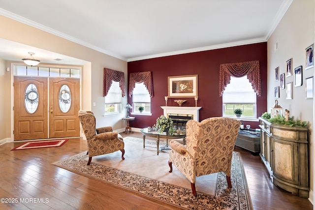 83 Brigantine Blvd, Waretown, NJ 08758 - living room featuring ornamental molding, dark wood-style flooring, a glass covered fireplace, and baseboards