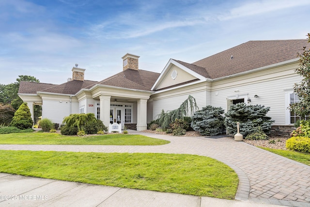 83 Brigantine Blvd, Waretown, NJ 08758 - view of front facade with french doors, a front yard, and a chimney