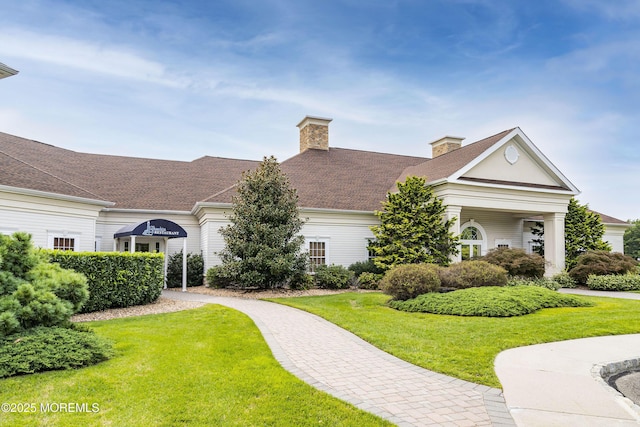 83 Brigantine Blvd, Waretown, NJ 08758 - view of front of home featuring a front lawn and a chimney