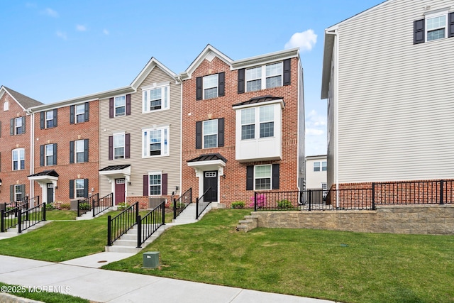 1915 Switzer Ave Unit 1915, Parlin, NJ 08859 - townhome / multi-family property with brick siding and a front lawn