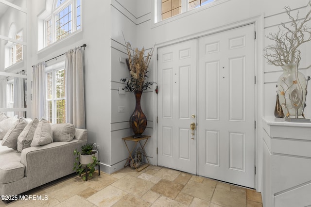 17 Meadow Run Ct, Jackson, NJ 08527 - foyer featuring a high ceiling, stone tile flooring, and baseboards