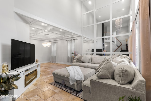 17 Meadow Run Ct, Jackson, NJ 08527 - living room with stone tile flooring, recessed lighting, stairway, baseboards, and a towering ceiling