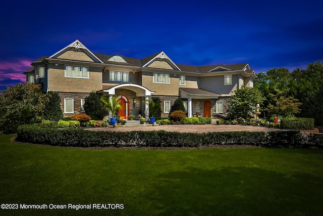 211 Cedar Ave, Long Branch, NJ 07740 - shingle-style home featuring stone siding and a front lawn