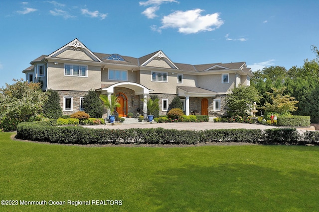 211 Cedar Ave, Long Branch, NJ 07740 - shingle-style home with stone siding and a front lawn