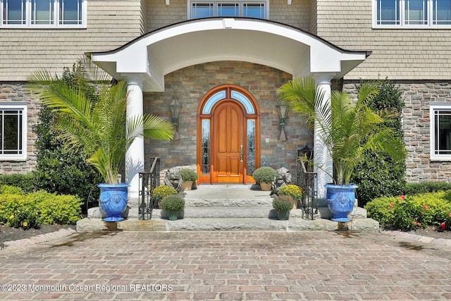 211 Cedar Ave, Long Branch, NJ 07740 - view of exterior entry featuring stone siding