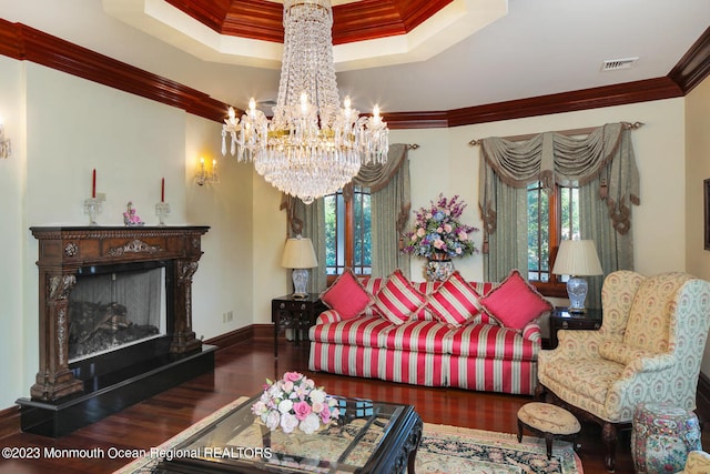211 Cedar Ave, Long Branch, NJ 07740 - living room featuring ornamental molding, wood finished floors, a high end fireplace, a tray ceiling, and a chandelier