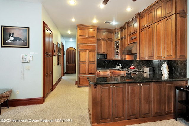 211 Cedar Ave, Long Branch, NJ 07740 - kitchen featuring black microwave, a peninsula, exhaust hood, baseboards, and glass insert cabinets