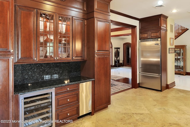 211 Cedar Ave, Long Branch, NJ 07740 - bar area with built in refrigerator, beverage cooler, arched walkways, tasteful backsplash, and baseboards