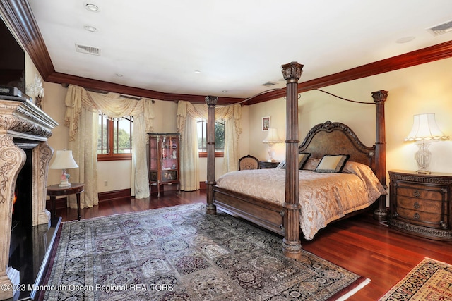 211 Cedar Ave, Long Branch, NJ 07740 - bedroom featuring decorative columns, ornamental molding, wood finished floors, and baseboards
