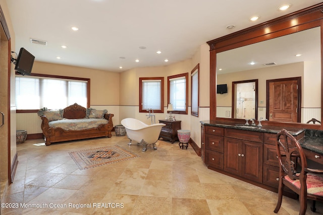 211 Cedar Ave, Long Branch, NJ 07740 - bedroom featuring baseboards, a sink, recessed lighting, and light stone finish floors