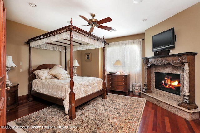 211 Cedar Ave, Long Branch, NJ 07740 - bedroom featuring a fireplace, wood finished floors, baseboards, and recessed lighting