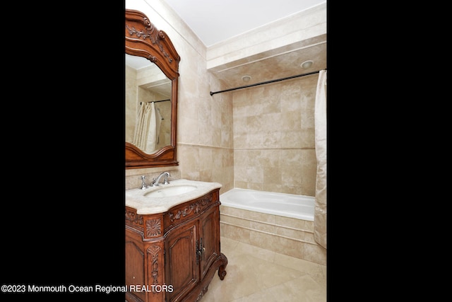 211 Cedar Ave, Long Branch, NJ 07740 - bathroom with tile patterned floors, vanity, and tiled shower / bath combo