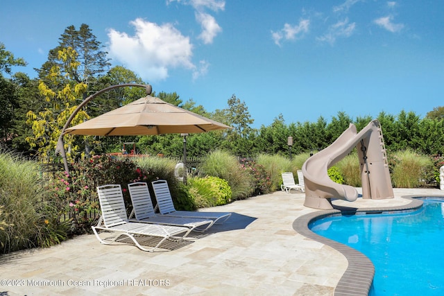211 Cedar Ave, Long Branch, NJ 07740 - swimming pool featuring a water slide and a patio