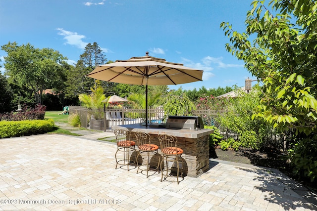 211 Cedar Ave, Long Branch, NJ 07740 - fenced backyard featuring a patio and area for grilling