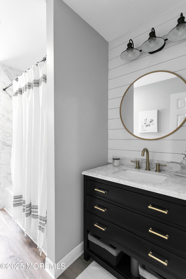 469 E Rd, Belford, NJ 07718 - bathroom with vanity, a shower with shower curtain, and wood finished floors