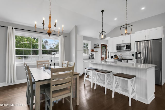 469 E Rd, Belford, NJ 07718 - dining area featuring lofted ceiling, a chandelier, dark wood-style floors, baseboards, and recessed lighting