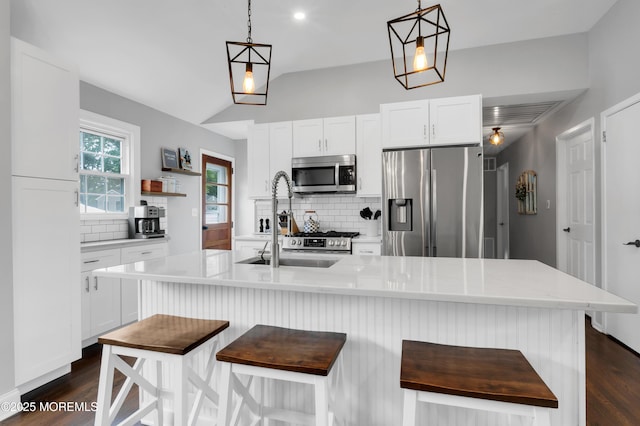 469 E Rd, Belford, NJ 07718 - kitchen with stainless steel appliances, backsplash, light countertops, dark wood-type flooring, and lofted ceiling