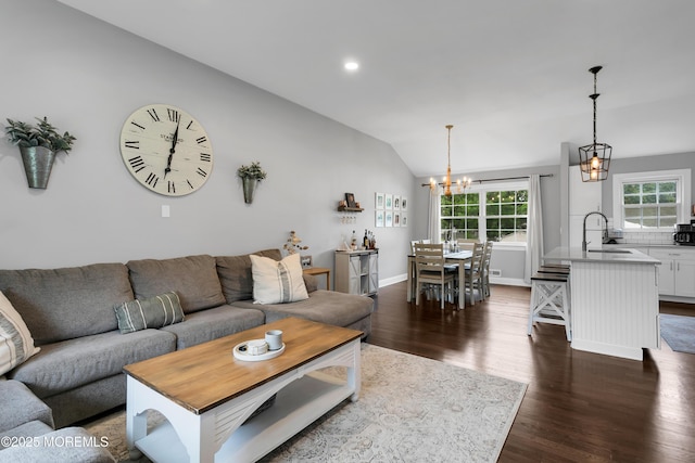 469 E Rd, Belford, NJ 07718 - living room with a chandelier, lofted ceiling, healthy amount of natural light, dark wood-type flooring, and recessed lighting