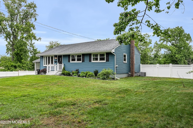 469 E Rd, Belford, NJ 07718 - view of front facade featuring a chimney, a shingled roof, and central AC unit