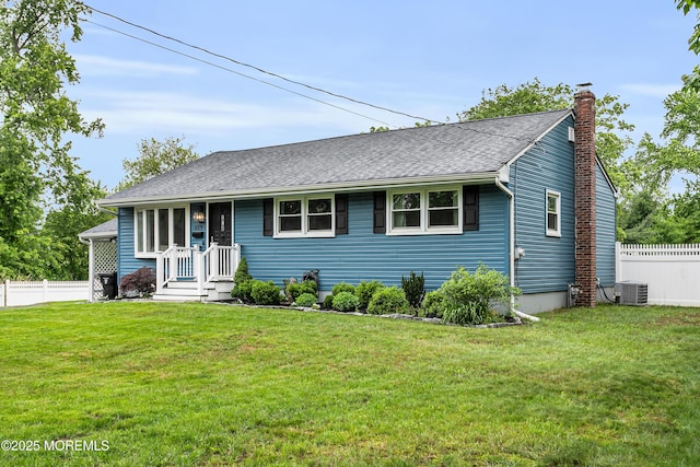 469 E Rd, Belford, NJ 07718 - view of front facade with central AC unit, a chimney, and roof with shingles