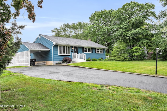 469 E Rd, Belford, NJ 07718 - ranch-style home with asphalt driveway, a chimney, a front yard, and a carport