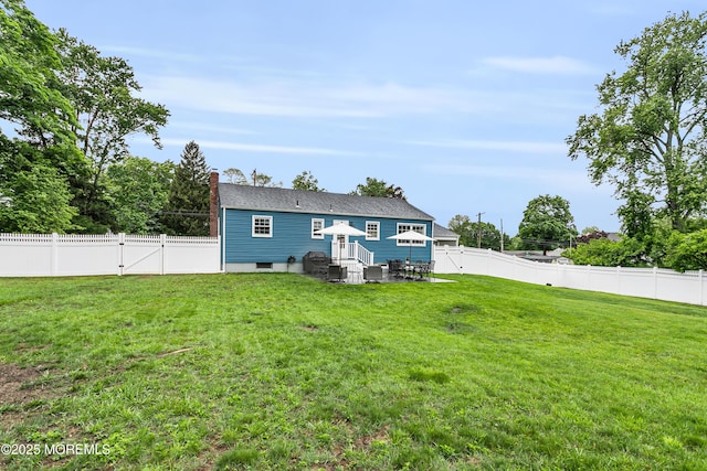 469 E Rd, Belford, NJ 07718 - rear view of house with a gate and a chimney