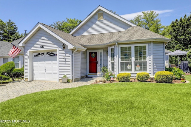 56 Hazel Dr, Freehold, NJ 07728 - view of front of home with an attached garage, a shingled roof, a front yard, and driveway