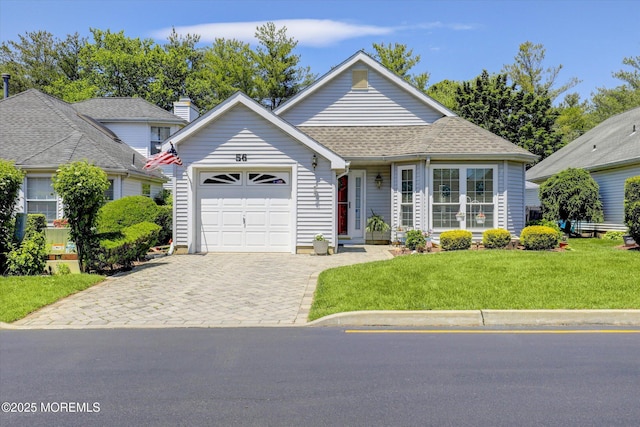 56 Hazel Dr, Freehold, NJ 07728 - view of front facade with a garage, decorative driveway, and a front yard