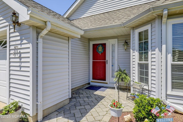 56 Hazel Dr, Freehold, NJ 07728 - property entrance featuring a shingled roof and a garage