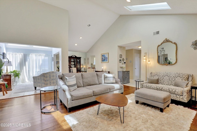 56 Hazel Dr, Freehold, NJ 07728 - living area featuring high vaulted ceiling, a skylight, wood finished floors, and recessed lighting