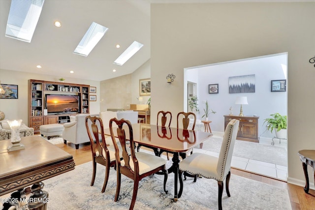 56 Hazel Dr, Freehold, NJ 07728 - dining area with a skylight, high vaulted ceiling, light wood-type flooring, recessed lighting, and baseboards