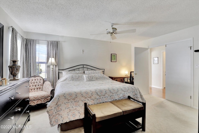 56 Hazel Dr, Freehold, NJ 07728 - bedroom featuring a textured ceiling, light carpet, and a ceiling fan