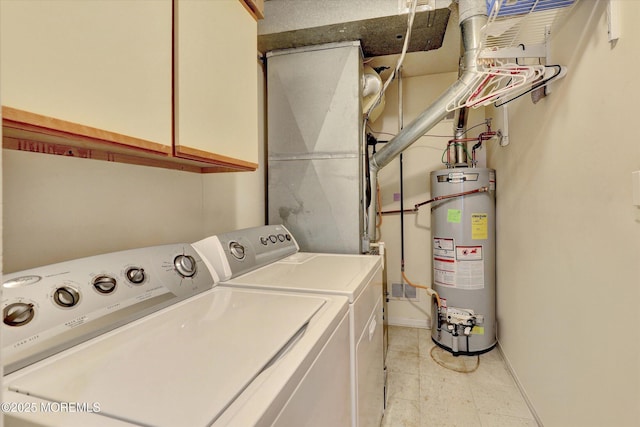 56 Hazel Dr, Freehold, NJ 07728 - laundry area featuring water heater, washer and dryer, cabinet space, and baseboards