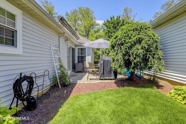 56 Hazel Dr, Freehold, NJ 07728 - view of green lawn featuring a patio area