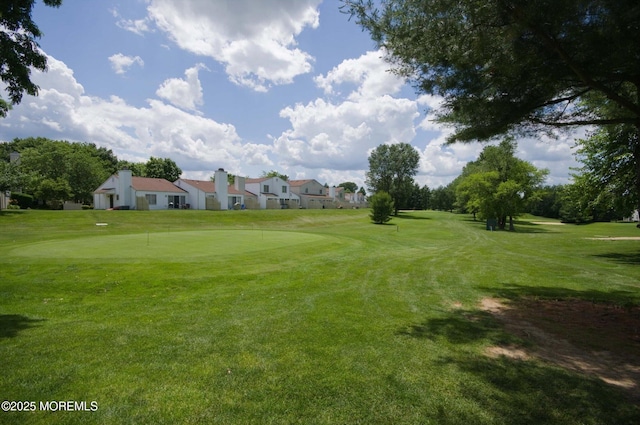 56 Hazel Dr, Freehold, NJ 07728 - surrounding community featuring golf course view, a yard, an area to practice putting, and a residential view
