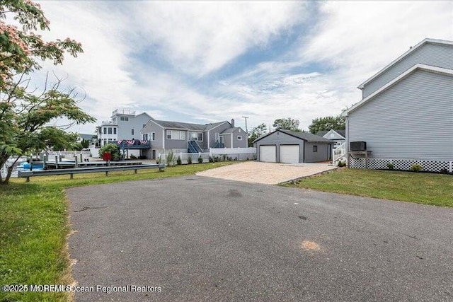 110 Island Rd, Toms River, NJ 08753 - view of front facade featuring a residential view, a garage, an outbuilding, and a front yard