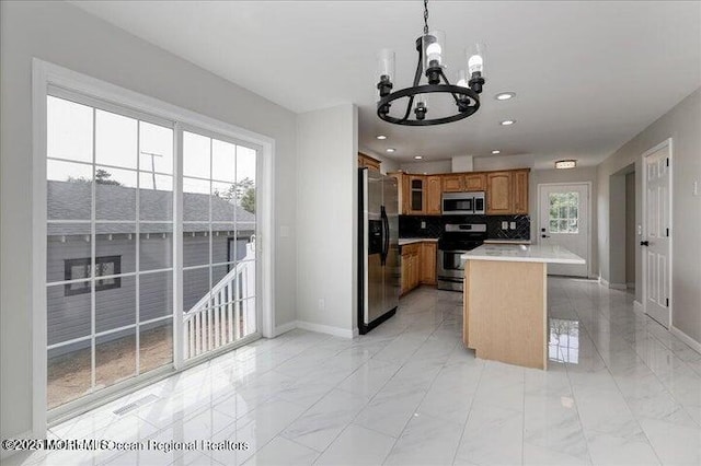 110 Island Rd, Toms River, NJ 08753 - kitchen with stainless steel appliances, a chandelier, brown cabinets, light marble finish flooring, and recessed lighting