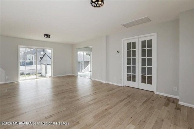 110 Island Rd, Toms River, NJ 08753 - unfurnished room with french doors, light wood finished floors, and healthy amount of natural light